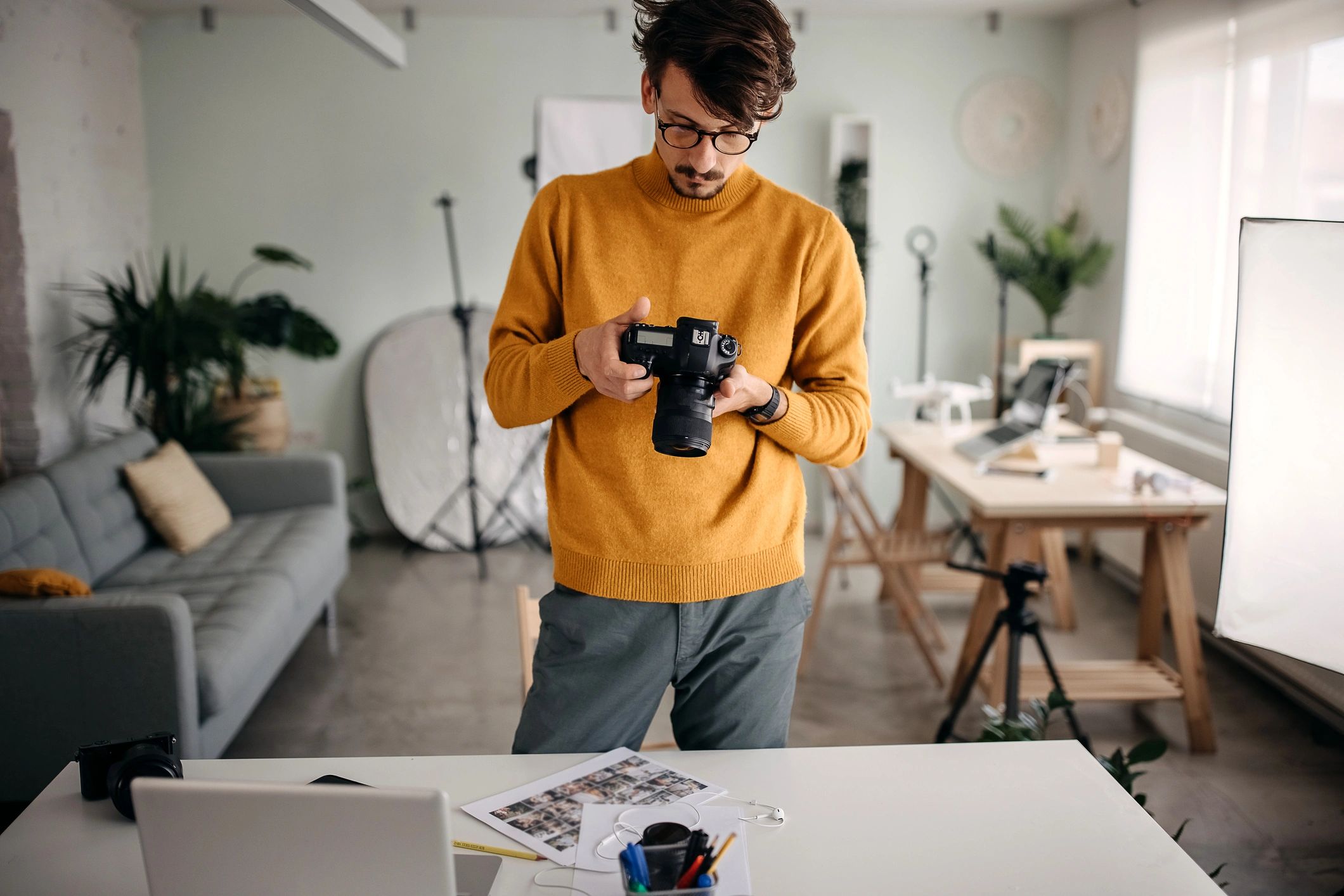 Photographer reviewing images in studio